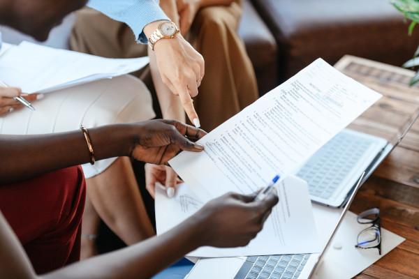 hands holding documents