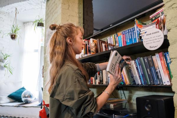 person putting books away